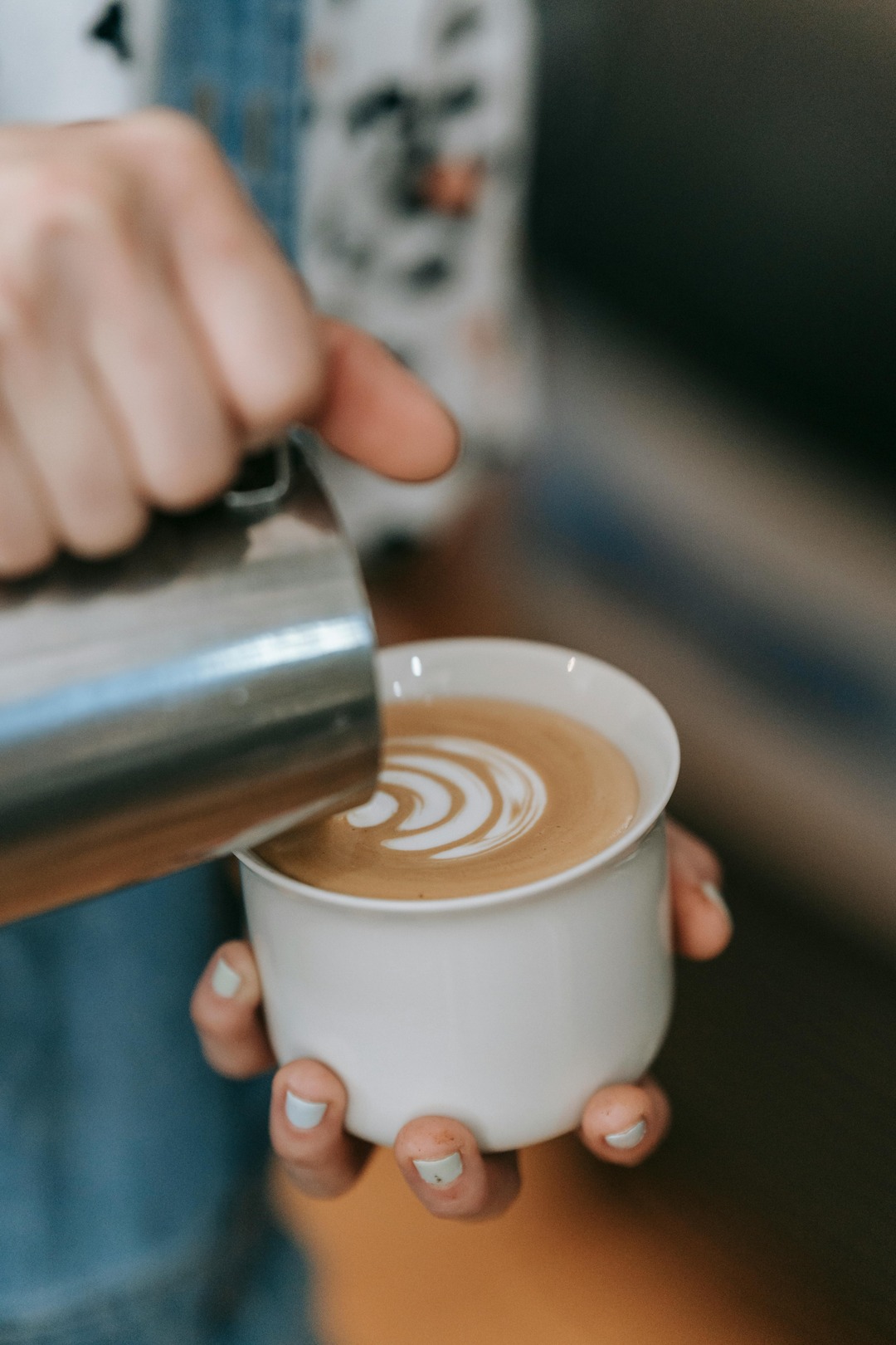Barista pouring coffee art